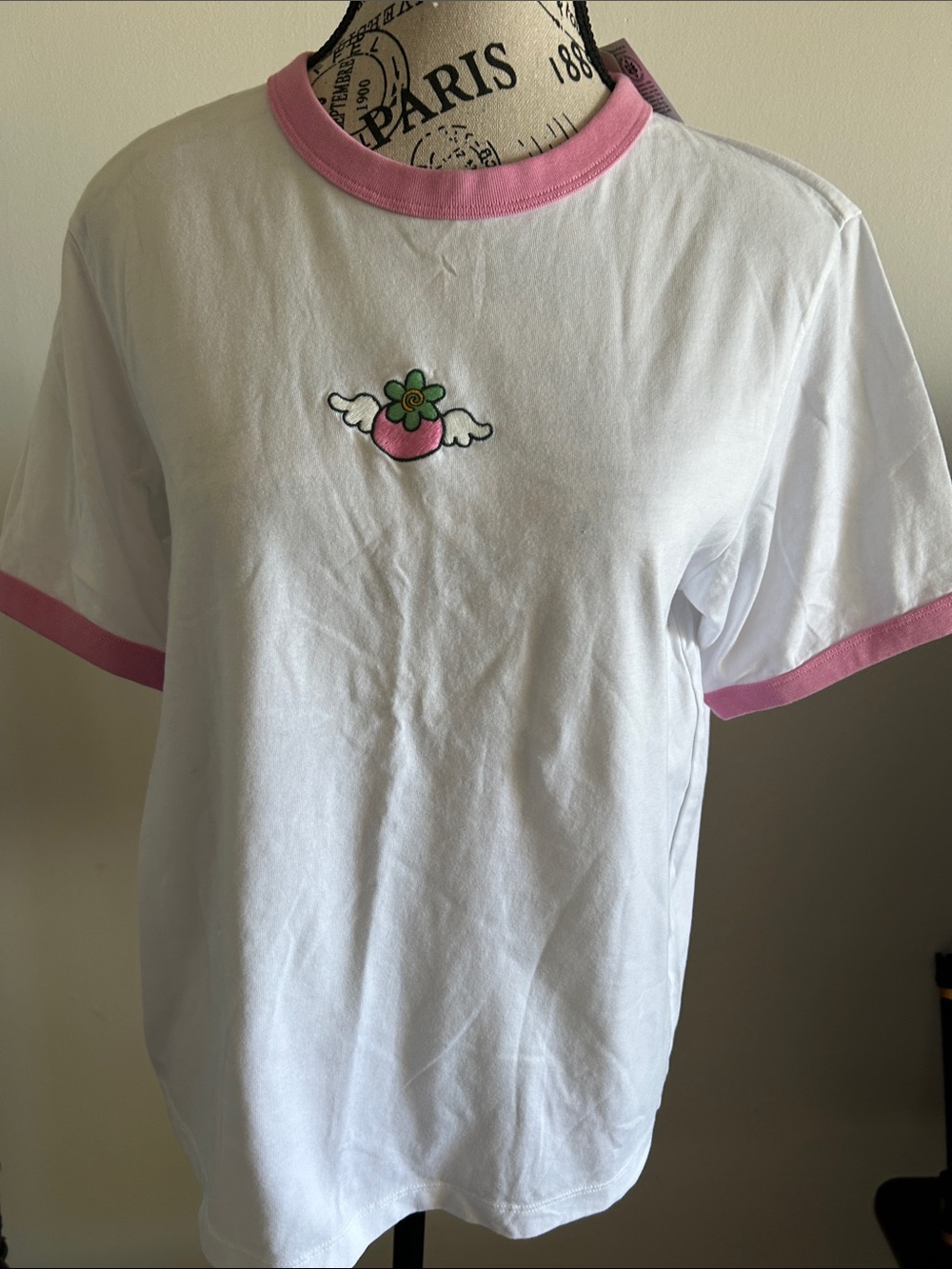 Uniqlo White Ringer Tee with Pink Trim and Winged Flower Patch